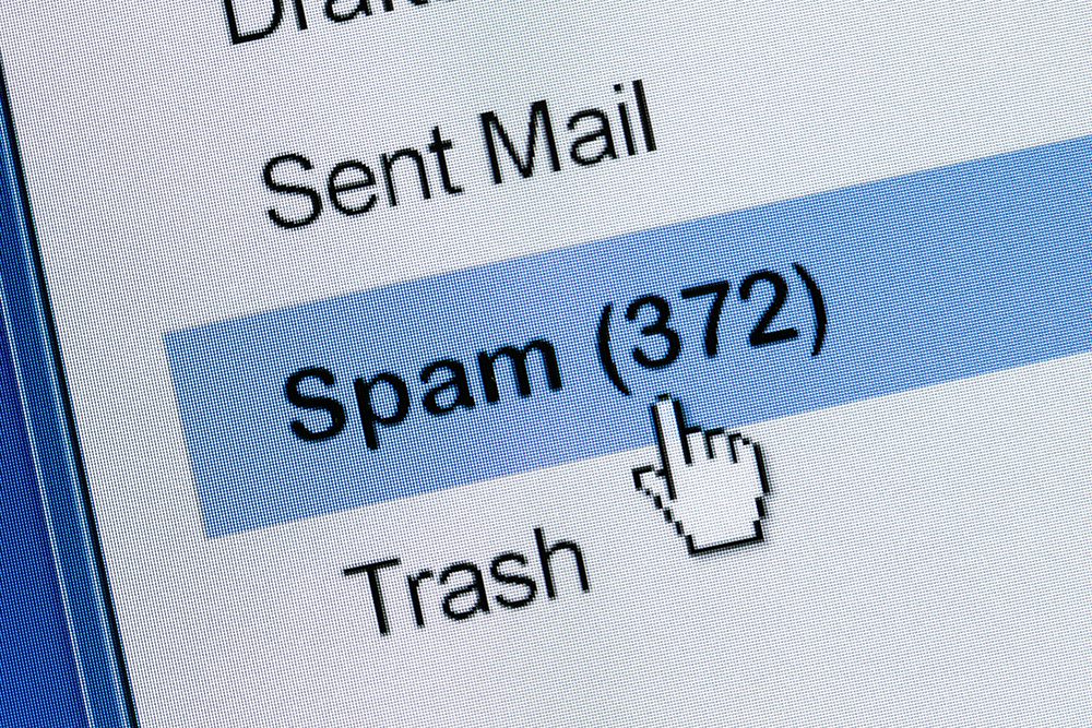 An image of a pointer mouse hovering over the spam folder with 372 emails.